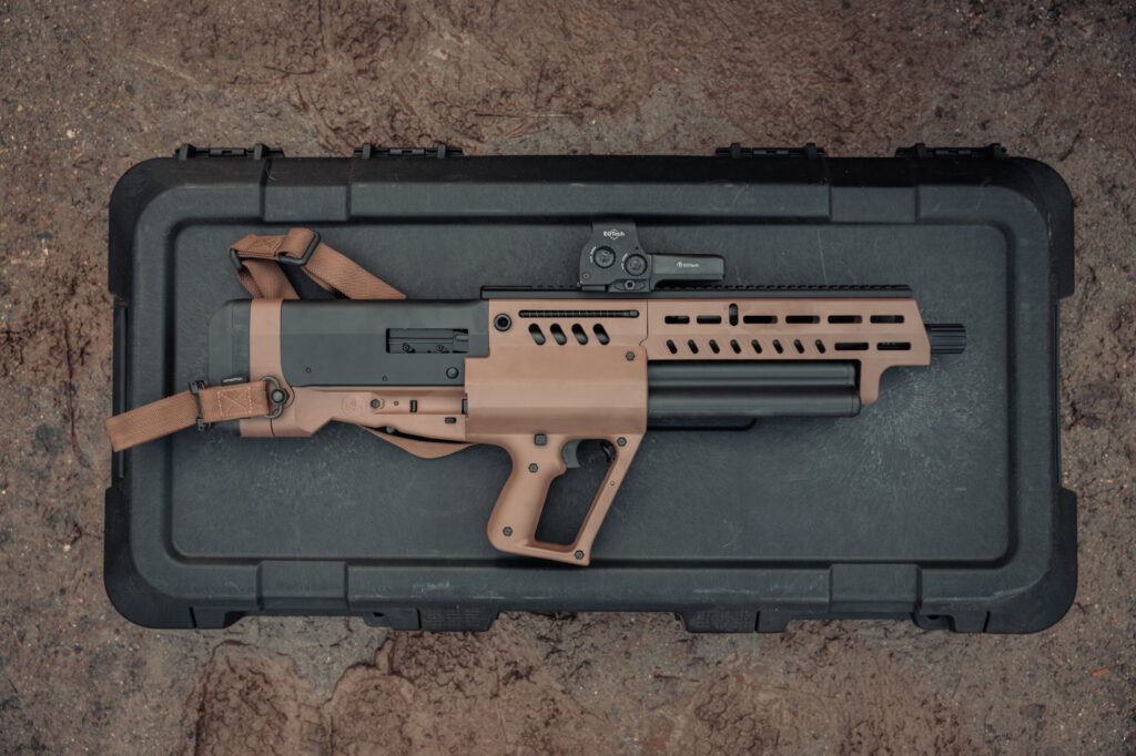 TS12, a bullpup shotgun resting on its case