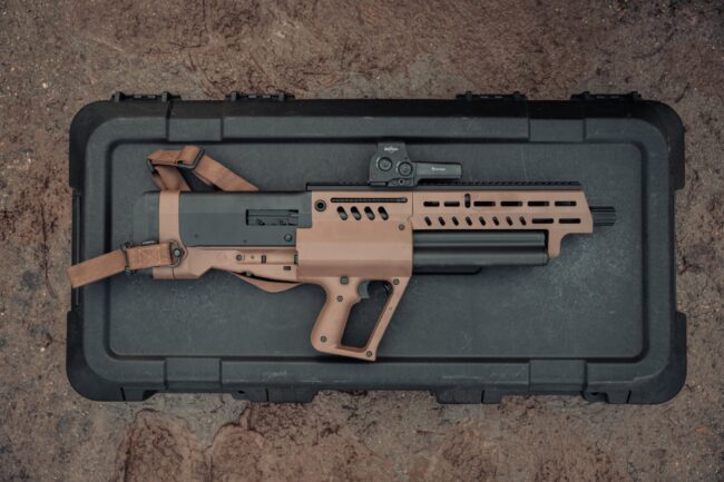 TS12, a bullpup shotgun resting on its case