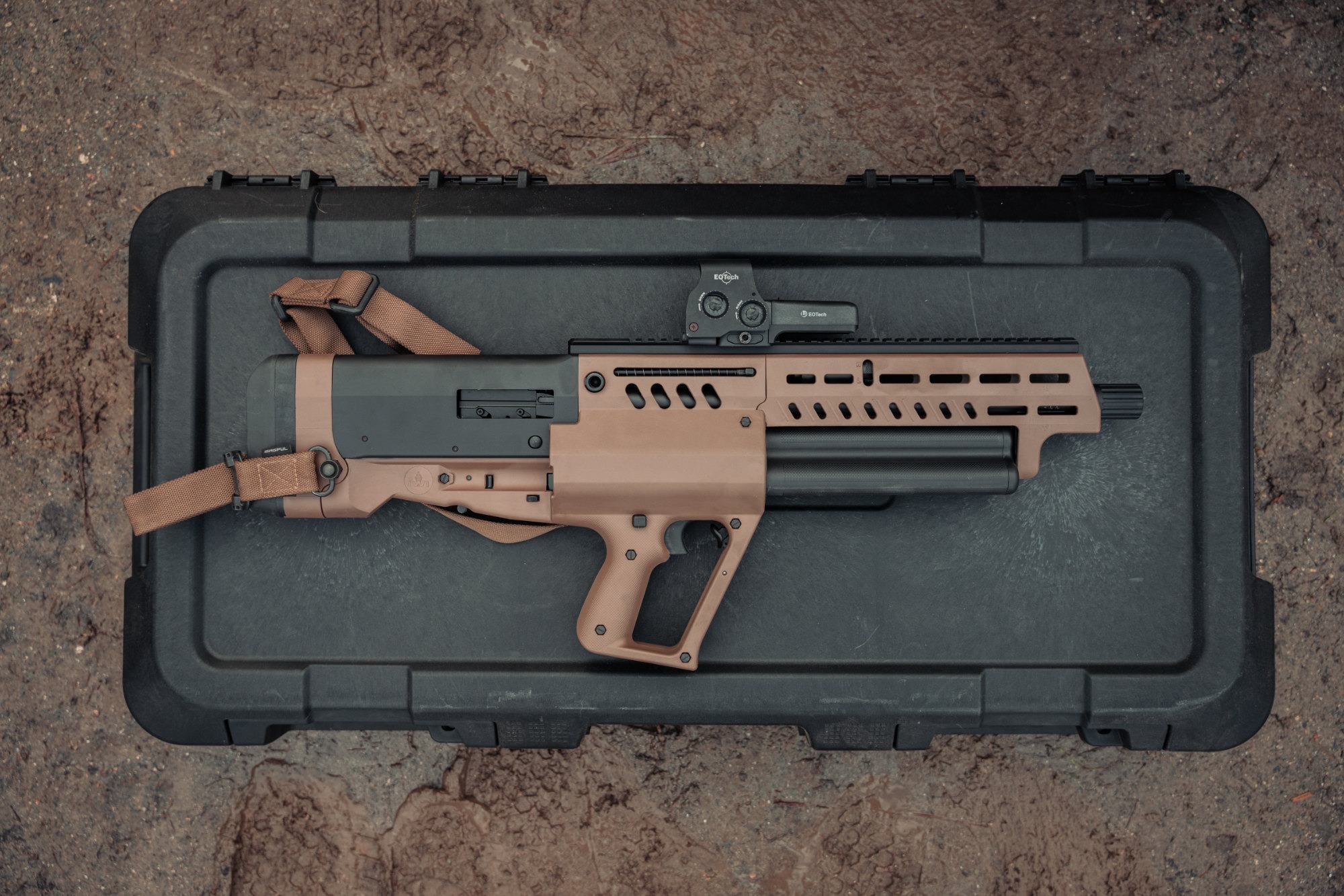 TS12, a bullpup shotgun resting on its case